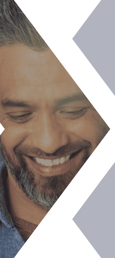 A smiling man with a beard is featured against a green and blue background, cropped into Textkernel's brand icon.